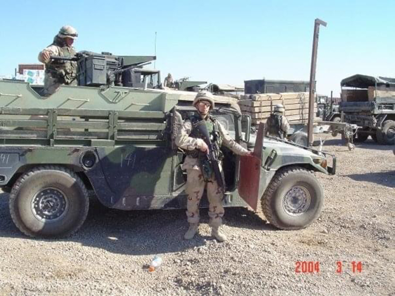 man in front of tank