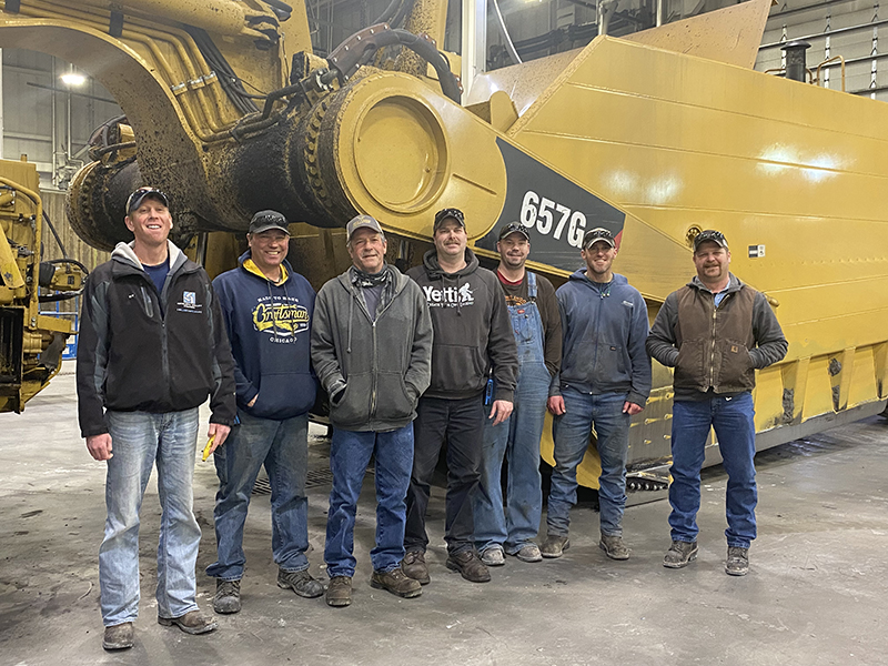 men standing in front of equipment