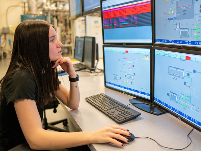 Woman sitting at computers