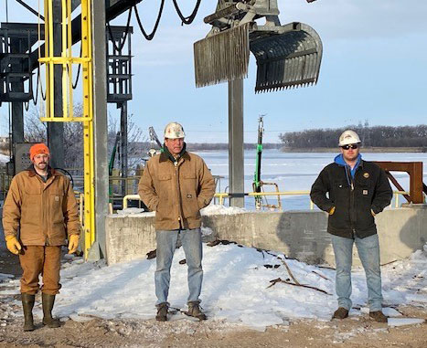 men standing near power plant