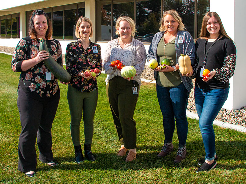 smiling women with vegetables