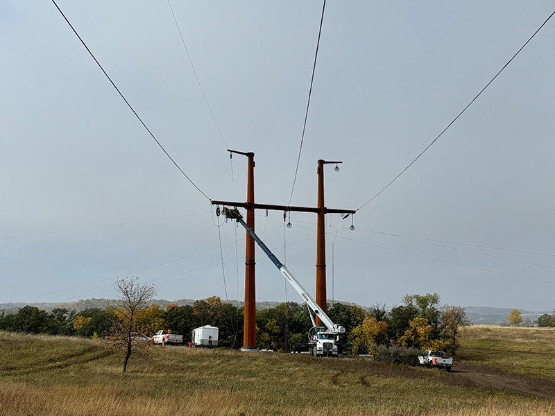 Employees working to energize the transmission line