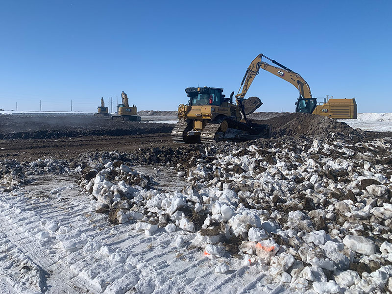 equipment moving dirt and snow