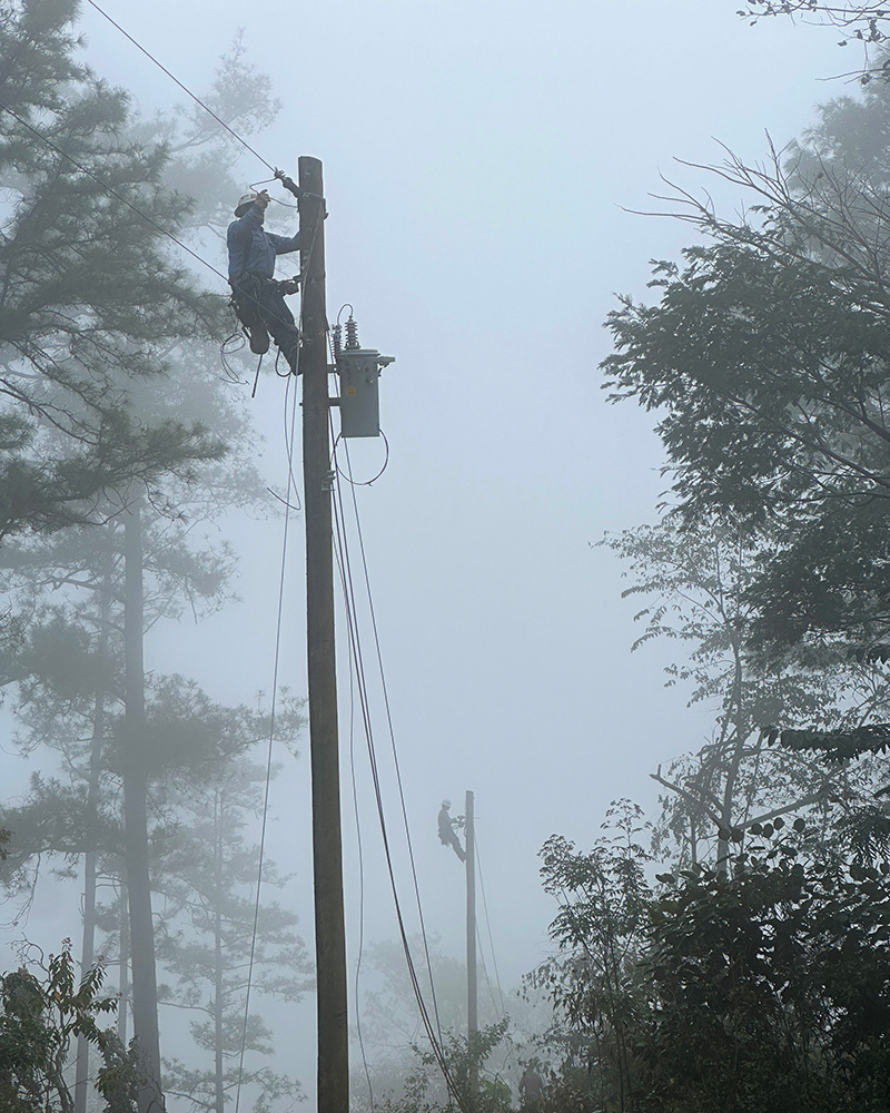 Lineworker in fog