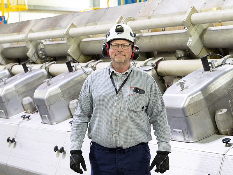 Erdmann standing in the plant