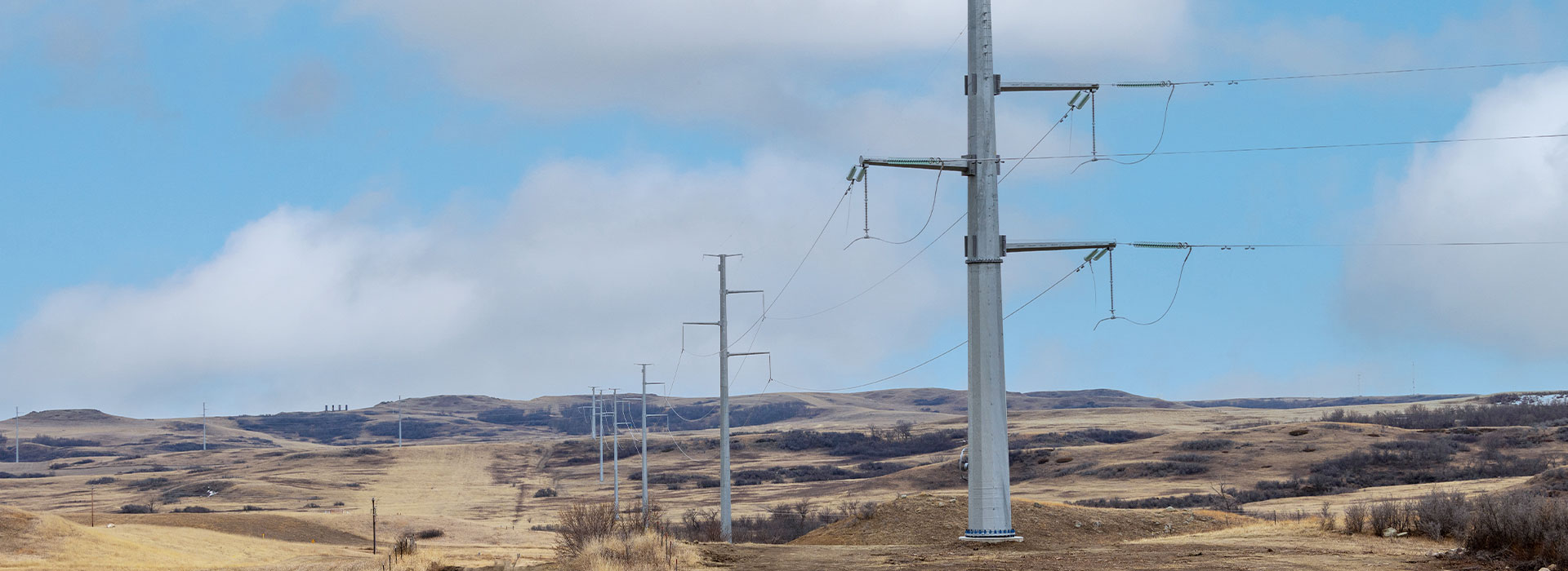 Transmission lines against a blue sky