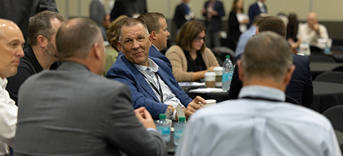 Members conversing at table