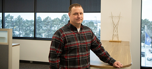 man standing in workplace