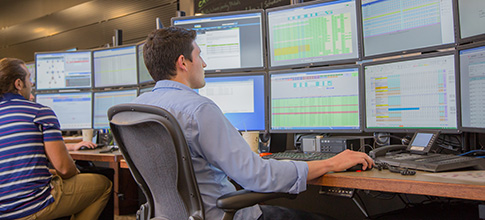 employee looking at screens