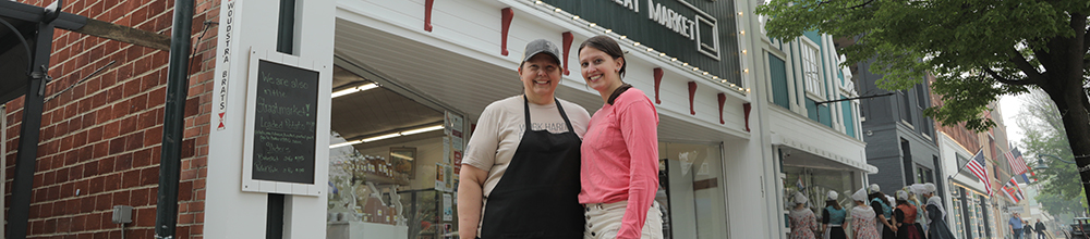 people standing in front of a store