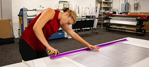 woman cutting paper