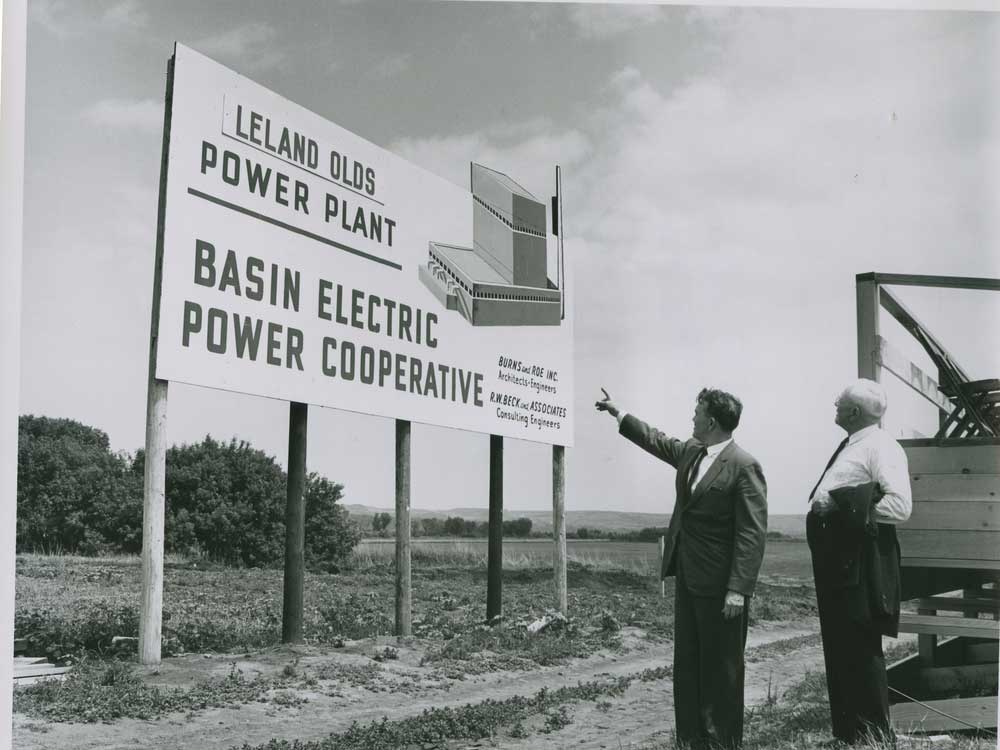 Two men reading the sign at Basin Electric’s Leland Olds Station in North Dakota