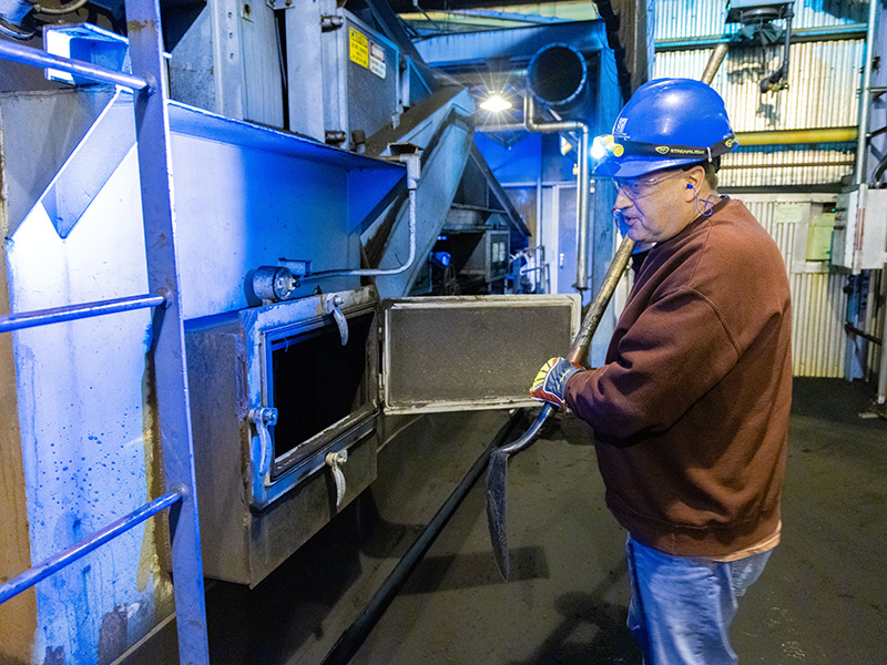 Rueb clears the grizzlies leading to the silos, ensuring the coal flows freely.