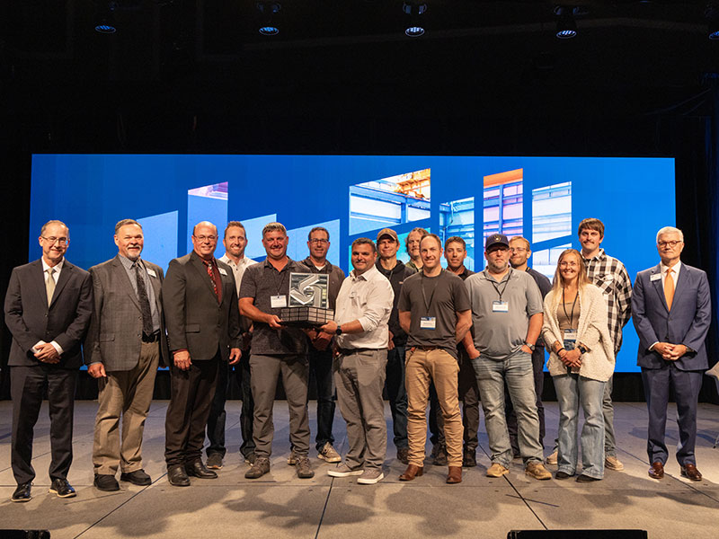 Onstage award presentation to the AVS team.