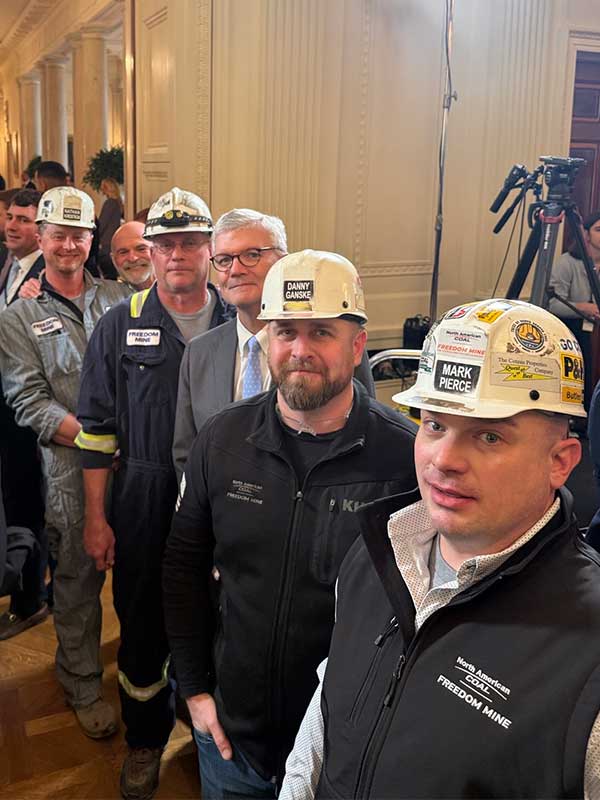 Brickhouse with representatives from the Freedom Mine